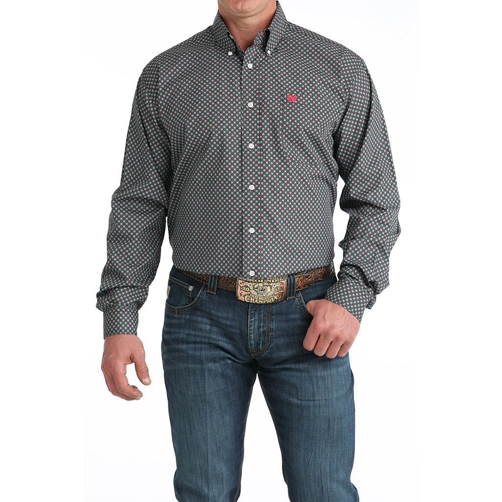 - Model wearing the Cinch Men’s Black Multi Geo Print Shirt in a front view, showing the bold geo pattern, long sleeves, and classic Western button‑down fit.
