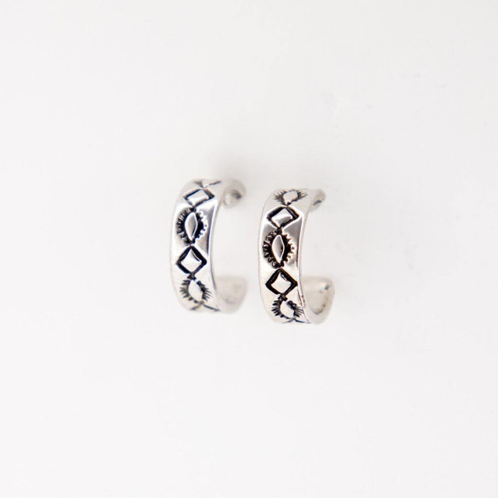 Close view of White Gold Diamond Stamped Hoop Earring