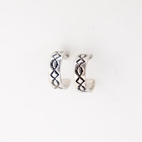 Close view of White Gold Diamond Stamped Hoop Earring