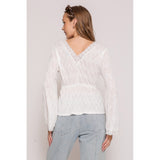 women's blouse with textured fabric and lace accents back view