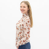 Side view of cream long sleeve horse print mesh shirt