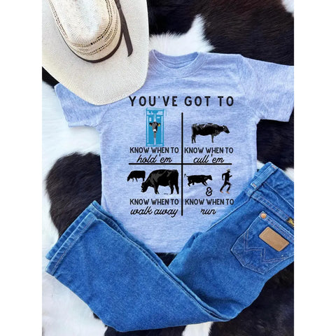 Kid's t-shirt featuring graphic of "You've Got to Know When to Hold 'Em"