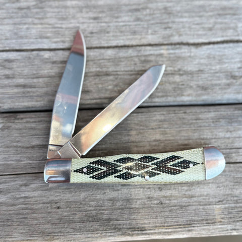 Two blade smooth pocket knife with southwest pattern handle.