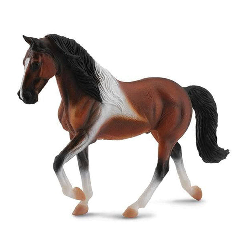 Model horse with brown, black, and white coloring