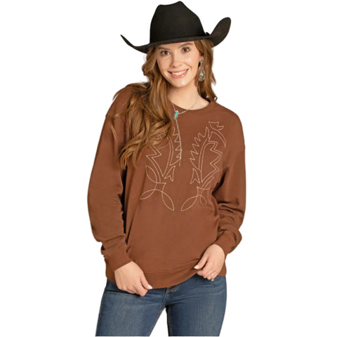 Woman wearing a brown long-sleeve crewneck sweatshirt with a bootstitch design