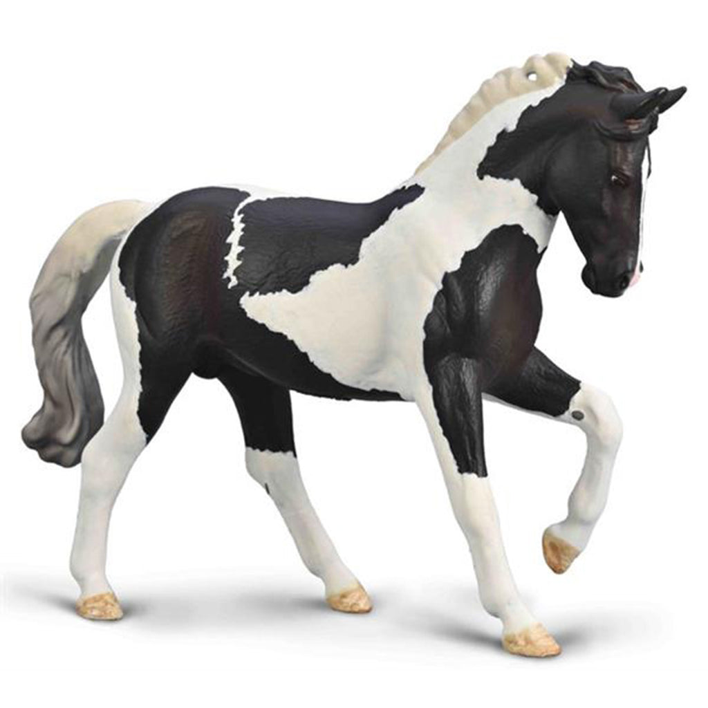Model horse with black and white pattern