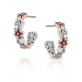 hoop earrings rose gold finished flowers that cover the silver tone