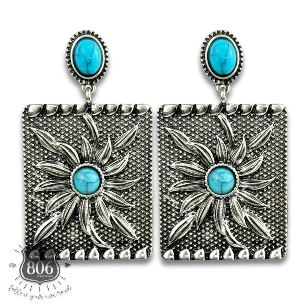 Close up view of Turquoise & Silver Sunburst Rectangle Earrings 