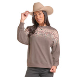 Model wearing a Cowboy Border Sweatshirt showing from the front with its Western‑inspired border design and relaxed cozy fit.