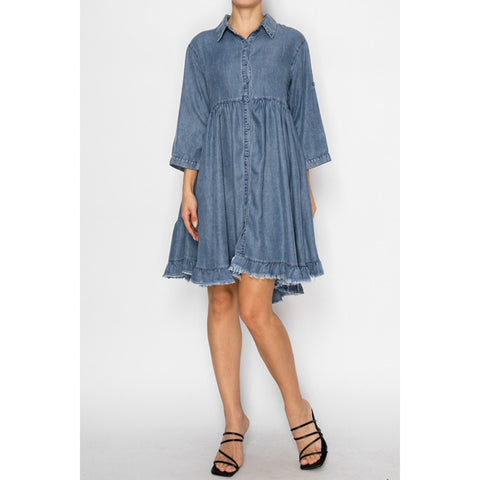 Model wearing the SW Chambray Flowy Dress showing the soft denim texture, relaxed silhouette, and flowy movement.