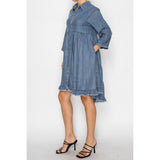 Side view of model in the SW Chambray Flowy Dress highlighting the pocket.