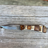 Open Damascus blade knife with stag and wood handle.