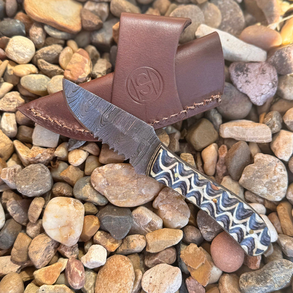 Damascus Knife with pakka wood handle and leather knife sheath.