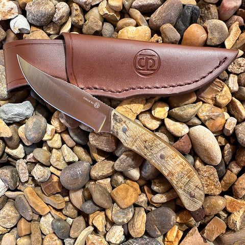 Ram horn knife with leather sheath.