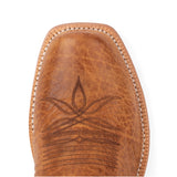 Close-up of a brown leather boot with intricate stitching on a white background