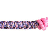 Close-up of a pink and purple braided headband on a white background