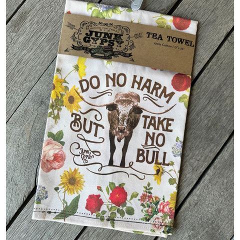 floral tea towel that has the sayong do no harm but take no bull  on it