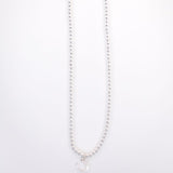 Bigger view of the faux pearl strand on the necklace.