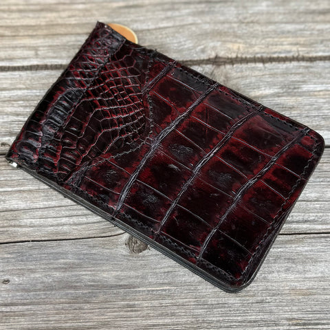 Dark black and red caiman leather money clip card holder.