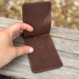 Inside of brown ostrich  card holder with money clip.