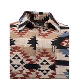 Close-up of bold black Aztec pattern on tan shirt jacket with snap-front and chest pocket detail