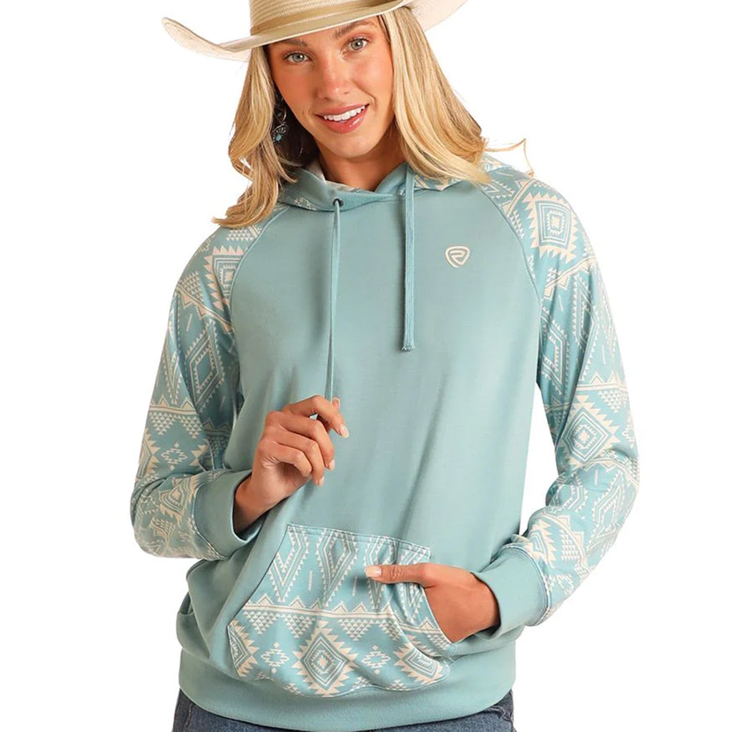 Teal hoodie with white Aztec print on the sleeves and front pouch pocket.
