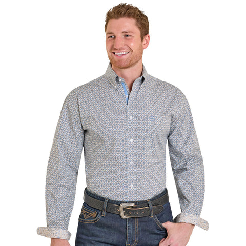 Front view of beige long sleeve collared button-down shirt with blue geometric print. 