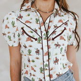 Model wearing cream western desert front facing. 