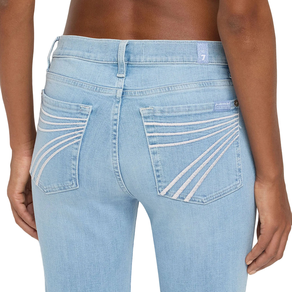 Close up view of the back pockets of the jeans. 