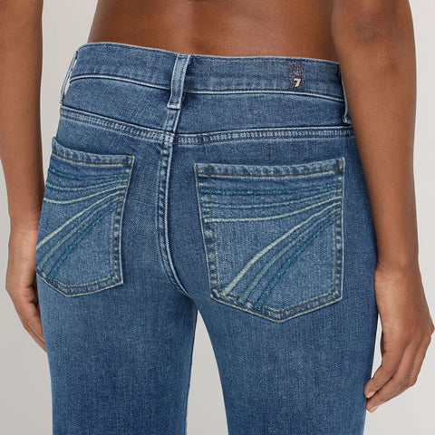 Close up view of the jean back pockets.