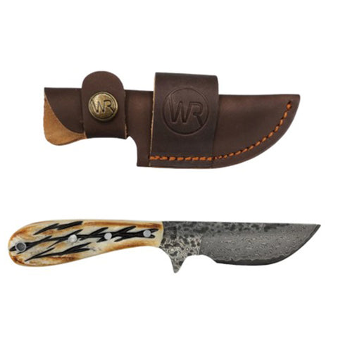 Knife with decorative handle and leather sheath on a white background