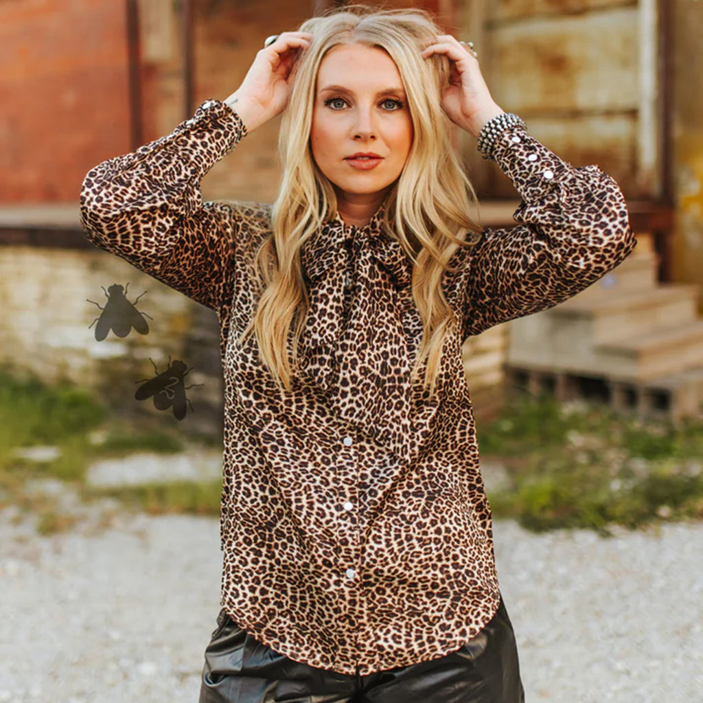 Long Sleeve Leopard print blouse with pearl snap closures.