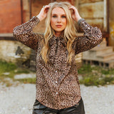 Long Sleeve Leopard print blouse with pearl snap closures.