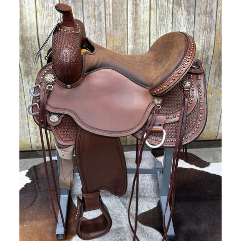 gold and silver studded leather saddle