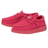 A pair of completely reddish pink shoes by HEYDUDE. 