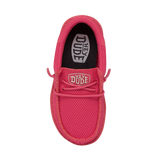 A reddish pink HEYDUDE shoe pictured from a top angle. The toe faces downwards.