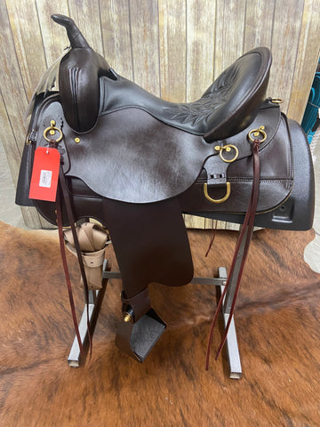 dark brown smooth leather saddle with brass rings