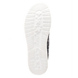 The white outsole of a HEYDUDE shoe. The background is also white.