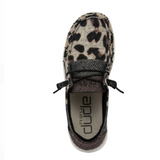 A HEYDUDE shoe featuring a leopard pattern with neutral patchwork. It's pictured from the top on a white background.