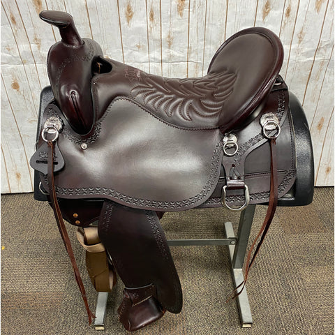 dark brown smooth saddle with design on seat