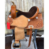 adult barrel saddle with roughout fenders and tooling on skirt